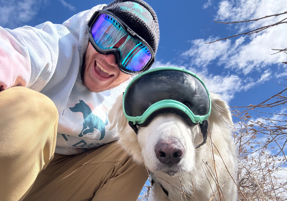 Dog and human wearing ski goggles